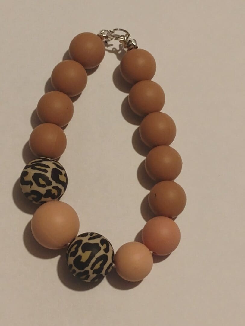 Beaded bracelet with wooden and patterned beads.