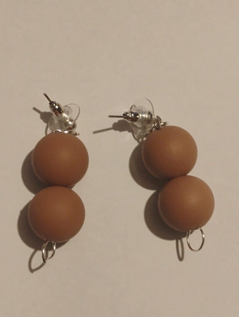 Handcrafted earrings with wooden beads and silver hooks.