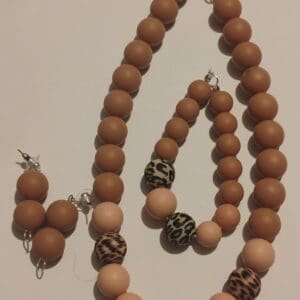 A set of brown prayer beads with decorative tassels.
