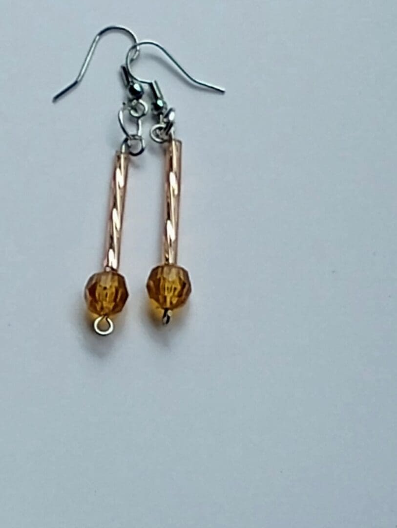 Elegant gold-toned earrings with amber beads.